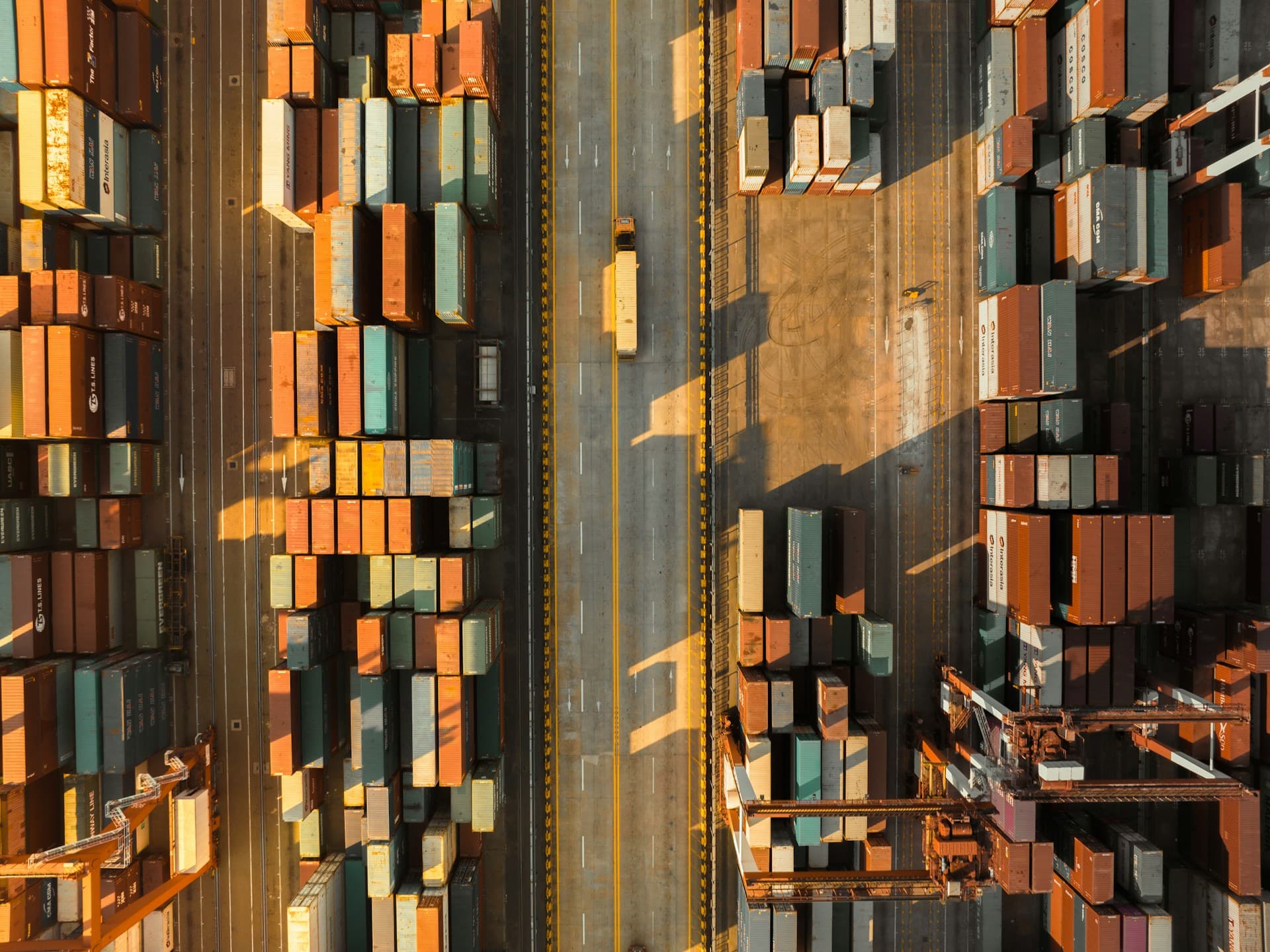 Aerial view of shipping containers at a port — Photo by Weichao Deng on Unsplash
